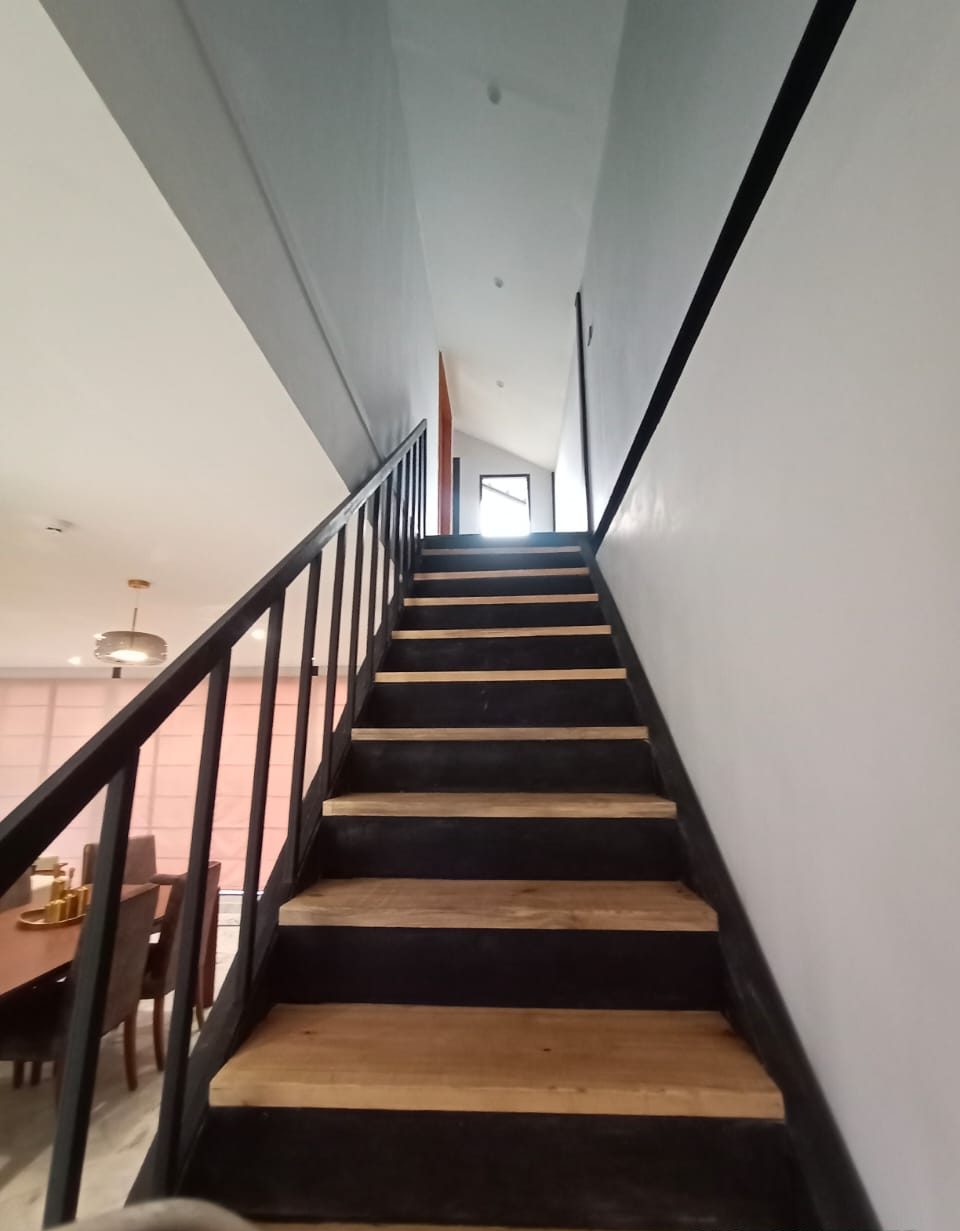 Steel stair to the upper level